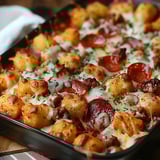 A hearty meal with layers of tater tots, cheese, and saucy beef baked until golden.