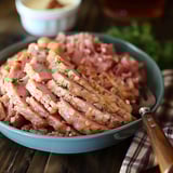 A bowl of ham spread on a rustic table.