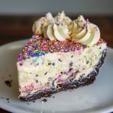 A slice sitting on a white plate.